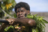 Denarau Island, Viti Levu, Fiji: male performer  covered in tree leaves - Fijian artist - photo by B.Cain