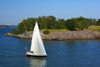 Helsinki, Finland: sailing boat passing by Suomenlinna sea fortress - UNESCO World Heritage Site - photo by A.Ferrari