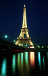 Paris: Eiffel tower - nocturnal - lights reflected on the river Seine - photo by Y.Baby