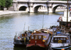 Paris: barges in the Seine river and the Pont Neuf - photo by Y.Baby
