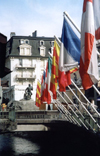 France / Frankreich -  Chamonix-Mont-Blanc (Haute-Savoi): on the bridge - flags and statue of G.Paccard - photo by M.Torres