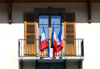France / Frankreich -  Le Grand Bornand: town hall - French flags on the balcony (photo by K.White)