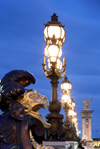 Paris, France: Alexandre III bridge - lion and street lamps - photo by A.Bartel