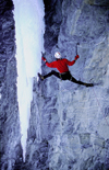 La Grave, Brianon, Hautes-Alpes, PACA, France: iceclimber on free hanging icefall by a verticall rock wall - mountaineering - photo by S.Egeberg