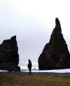 Franz Josef Land - Hall Island: Twin spires, person at Cape Tegethoff (photo by Bill Cain)
