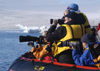 57 Franz Josef Land: Photographers with cameras, in zodiac - photo by B.Cain