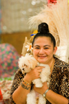 Papeete, Tahiti, French Polynesia: Tahitian woman wearing a leopard pattern, accompanied by her dog - photo by D.Smith