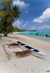 Papetoai, Moorea, French Polynesia: outrigger boat on a fine white sand beach - photo by D.Smith