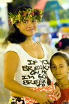 Papeete, Tahiti, French Polynesia: portrait of a Tahitian woman wearing a flower garland and her daughter - photo by D.Smith