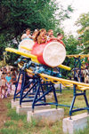 Comrat / Komrat, Gagauzia, Moldova: children on a roller coaster - amusement park in the town center - photo by M.Torres