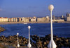 Galicia / Galiza - A Corua: lamp posts, beach and the town - photo by S.Dona'