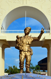 Banjul, The Gambia: statue of unknown soldier wild child, making a V-sign - triumphal arch at the entrance to the capital - Arch 22, the gate to Banjul, between the Banjul-Serrekunda Highway and  Independence Drive - marks the coup d'etat of July 22, 1994, led by Yahya Jammeh - photo by M.Torres