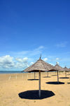 Banjul island, The Gambia: beach with golden sand beach on the north shore of Banjul Island, near the Laico Atlantic hotel - beach umbrellas and deep blue sky - photo by M.Torres