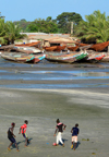 Barra, The Gambia: beach soccer against a background of wooden fishing boats - photo by M.Torres