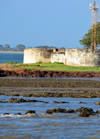 Barra, The Gambia: bastions of Fort Bullen at Barra Point - fort and ligh navigation light at the estuary of the River Gambia - UNESCO world heritage - photo by M.Torres