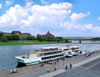 Dresden, Saxony / Sachsen, Germany / Deutschland: tour ship on the Elba river - in the background the Saxonian State Ministry of Finance, the Saxonian State Chancellery and the GDR built Carolabrcke bridge - photo by E.Keren