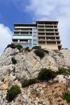 Gibraltar: cliffhanger apartment buildings in front of the Devil's Bellows - on The Rock space is precious, civil engineers and architects have to be creative - photo by M.Torres