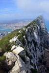 Gibraltar: view along the ridge and cliff of the Rock towards Middle Hill - La Linea in Spain in the background - Upper Rock Nature reserve - photo by M.Torres