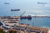 Gibraltar: harbour area - warehouses and main wharf - pipe-laying ship -  photo by M.Torres