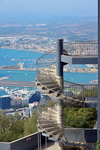 Gibraltar: spiral stairs at the cable car summit station with the airport and La Linea in the background - photo by M.Torres