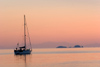 Greece - Paros: Sunset view of a sailboat in Paroikia harbour - photo by D.Smith