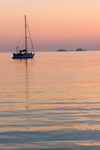 Greece - Paros: Sunset view of a sailboat in Paroikia harbour II - photo by D.Smith