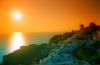 Greek islands - Santorini / Oia: Orange sunset - town and windmills - photo by D.Smith