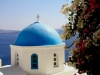 Greek islands - Santorini / Thira: flowers and blue dome - church dome - cupola - photo by A.Dnieprowsky