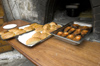 Greece, Karpathos, Olymbos:fresh, oven-baked dishes come our for consumption in Olymbos - photo by P.Hellander