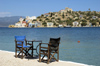Greece, Kastellorizo: chairswith a view. Sit out on the edge of Kastellorizo harbour or jump in thewater for a swim - photo by P.Hellander