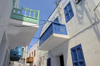 Greece, Dodecanese Islands,Nisyros: painted wooden balconies overlooking the streets of Mandraki - photo by P.Hellander