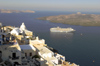 Greece, Cyclades, Santorini: dawn breaks over Santorini and a cruise ship lies at anchor - photo by P.Hellander
