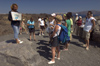 Greece, Cyclades, Santorini: a guide explains the details during a visit to the volcanic islet of MegaliKameni - photo by P.Hellander