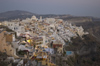 Greece, Cyclades, Santorini: the lights come on in Fira as the sun sets over Santorini - photo by P.Hellander