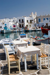 Greece - Paros: restaurant tables of the harbour in Naousa town - photo by D.Smith