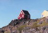 Greenland - Qaqortoq: shortage of residential housing spaces forces some to top of the rock (photo by G.Frysinger)