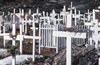 Greenland - Ilulissat / Jakobshavn - cemetery with simple wood crosses, partly decorated with plastic flowers - photo by W.Allgower