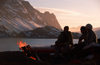 Greenland, Apussuit: skiers around fire in camp - photo by S.Egeberg