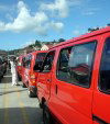 Grenada - public transport abounds - red minibuses (photographer: R. Ziff)