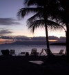 Guadeloupe / Guadalupe / Guadelupe: deck chairs and coconut trees - sunset (photographer: R.Ziff)