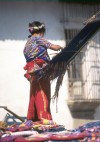 Guatemala - Antigua Guatemala (Sacatepequez province): woman weaving on a back strap loom (photographer: Mona Sturges)