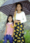 Guatemala - Lago de Atitln: umbrella sisters (photo by A.Walkinshaw)