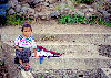 Guatemala - Lago de Atitln: Lago de Atitln: girl sitting on steps (photo by A.Walkinshaw)
