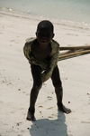 Rubane Island, Bijags Archipelago - UNESCO biosphere reserve, Bubaque sector, Bolama region, Guinea Bissau / Guin Bissau: playful boy on the beach / rapaz divertido na praia - photo by R.V.Lopes