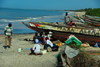 Praia de Varela / Varela beach, Cacheu region, Guinea Bissau / Guin Bissau: fishing boats and people on the beach / gente e barcos de pesca tradicional na praia - photo by R.V.Lopes
