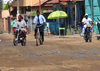 Ouanaminthe / Juana Mendez, Nord-Est Department, Haiti: traffic on main street - mud and bikes - photo by M.Torres