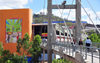 Tegucigalpa, Honduras: bridge over Ro Choluteca, leading to La Isla market - National Stadium and Peace Monument in the background - photo by M.Torres