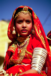 India - Jaisalmer, Rajasthan: a girl with typical clothes and jewels during the camel festival - photo by E.Petitalot