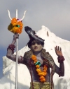 India - Narendranager (Uttaranchal): young man with snake dresses as Lord Shiva - parade marking the beginning of the traditional Hindu October festival of Navaratri (photo by Rod Eime)