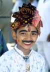 India - Narendranager (Uttaranchal): young boy enjoys taking part in a costume parade - festival of Navaratri (photo by Rod Eime)